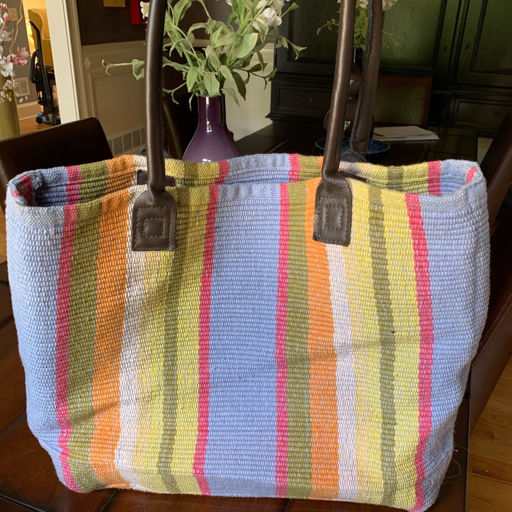 Leather bottom and handles colorful woven bag